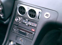 Brushed Aluminum center vent and machined Aluminum Bezels outfit this Porsche 928.